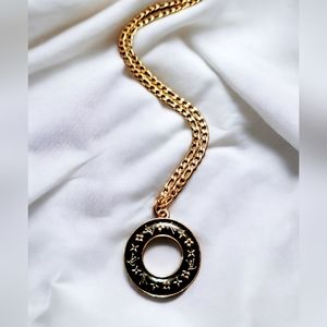 Round charm on a gold plated stainless steel necklace